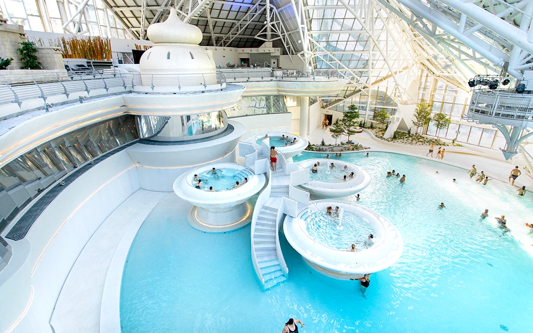 Caldea spa complex in Andorra with thermal pools and modern glass architecture.