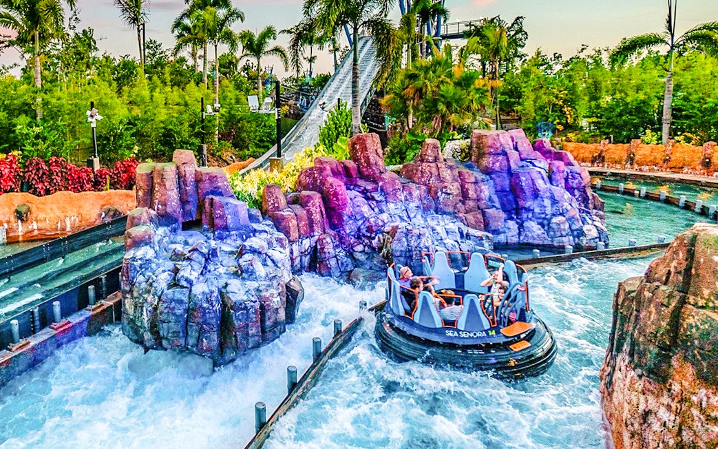 Raft navigating rapids on Infinity Falls ride at SeaWorld Orlando.