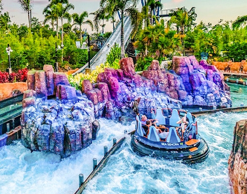Raft navigating rapids on Infinity Falls ride at SeaWorld Orlando.