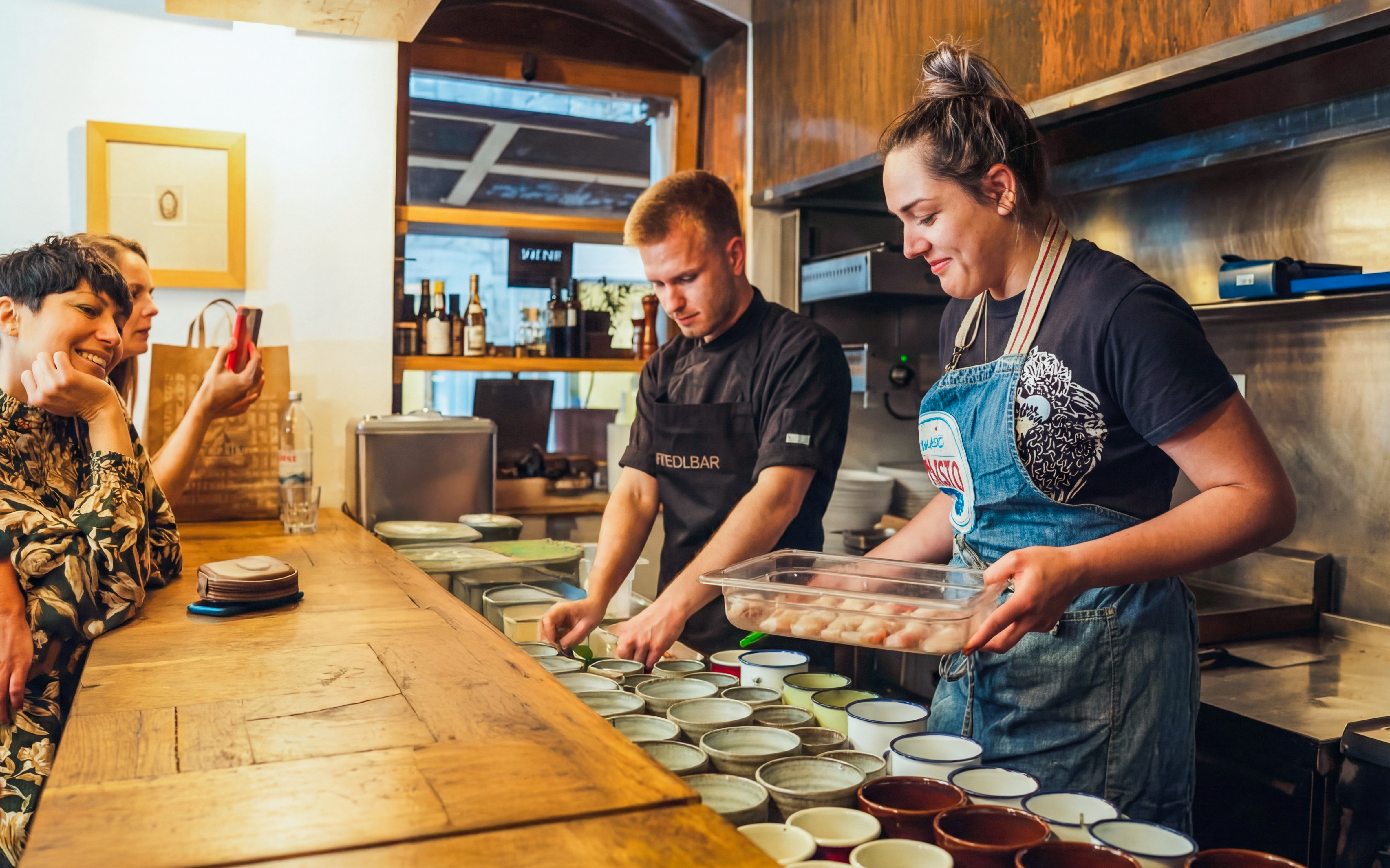 Wine tasting preparation in Diocletian’s Palace kitchen with chefs and guests.
