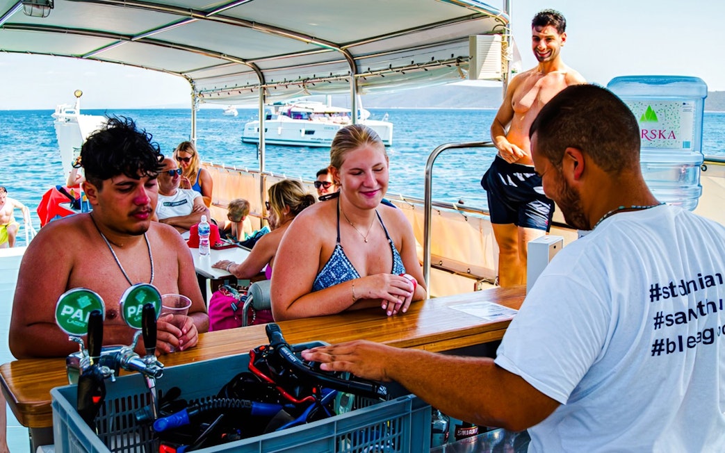 Guests enjoying drinks on a boat during Blue Lagoon and 3 Island tour from Split.