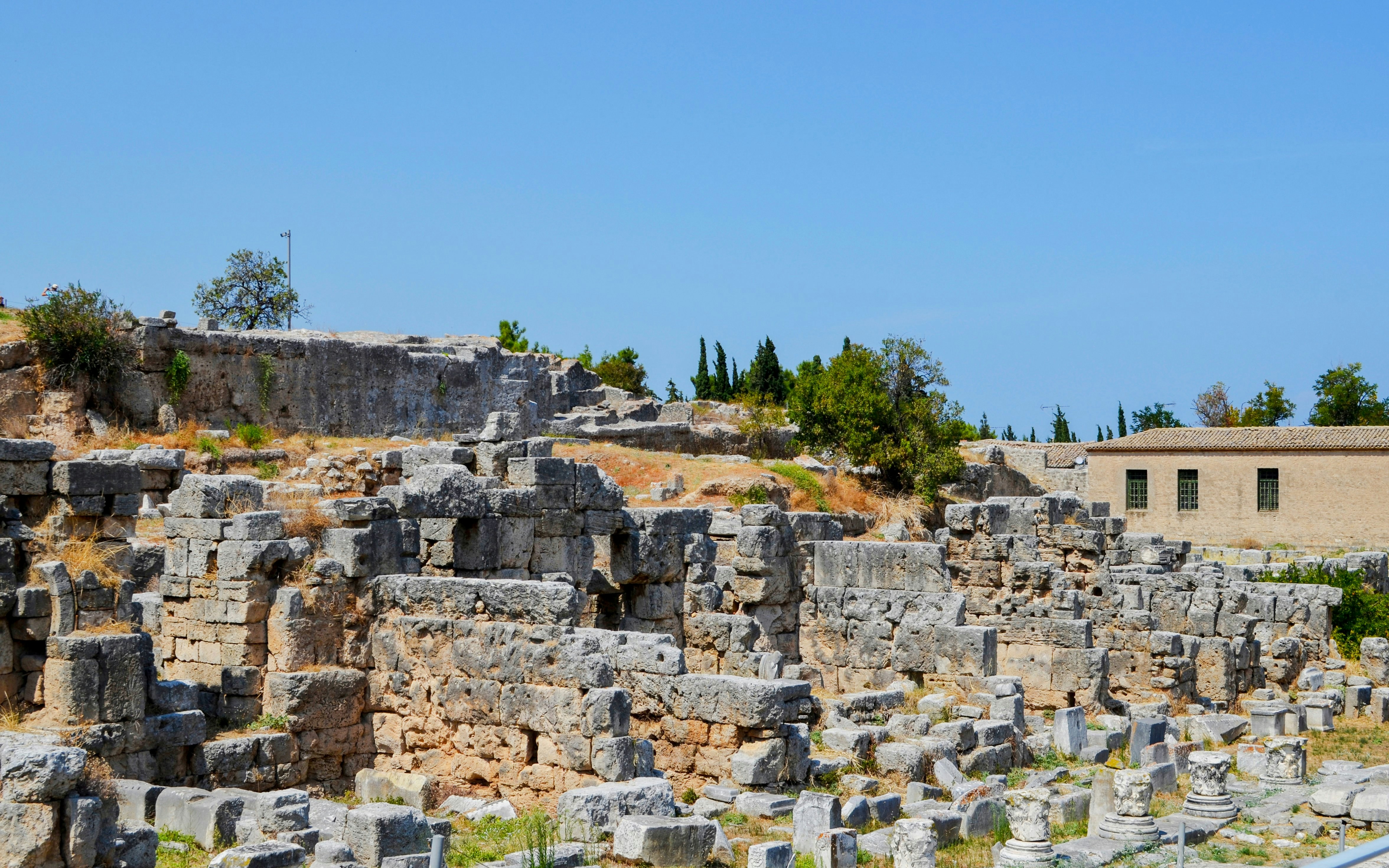 Ancient ruins of the Acropolis Temple of Apollo in Ancient Corinth, Mycenae, Greece.