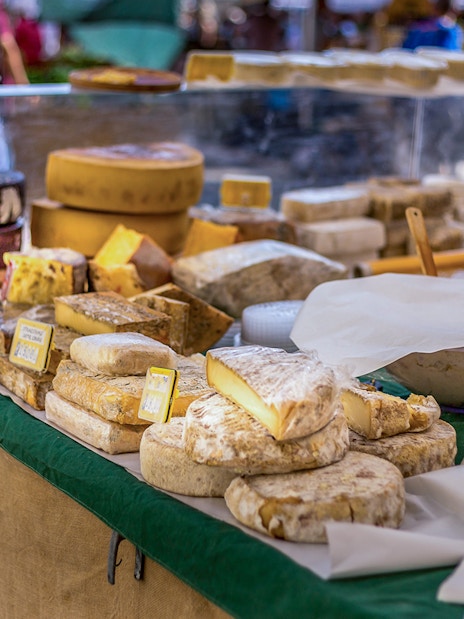 Cheese selection at a market stall during a guided food tour in Florence.