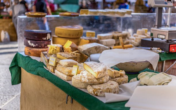 Cheese selection at a market stall during a guided food tour in Florence.