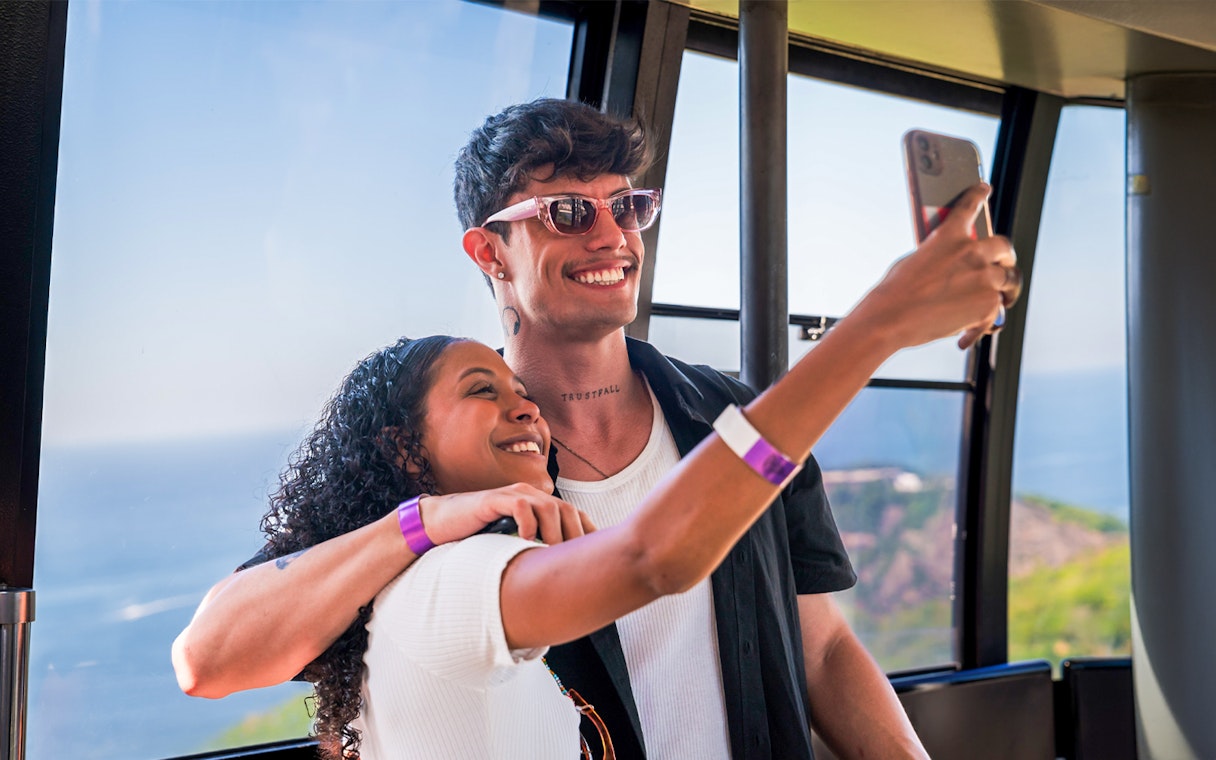 Guests taking a selfie inside the cable car to Sugarloaf Mountain, Rio de Janeiro.