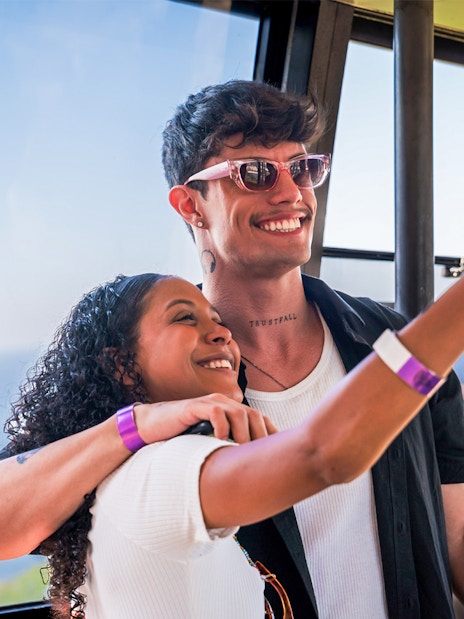 Guests taking a selfie inside the cable car to Sugarloaf Mountain, Rio de Janeiro.