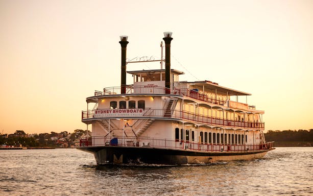 Showboat on Sydney Harbour during sunset for Vivid Sydney 3-hour dinner cruise with live cabaret.