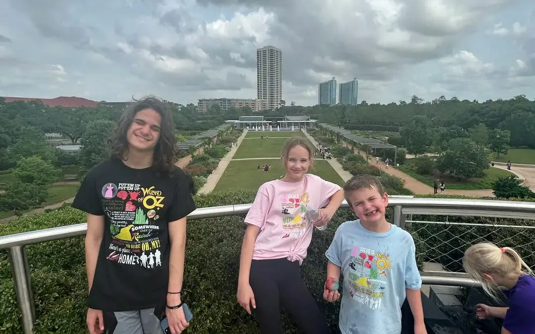 Children enjoying the view at Houston Museum District garden during self-guided city exploration game.