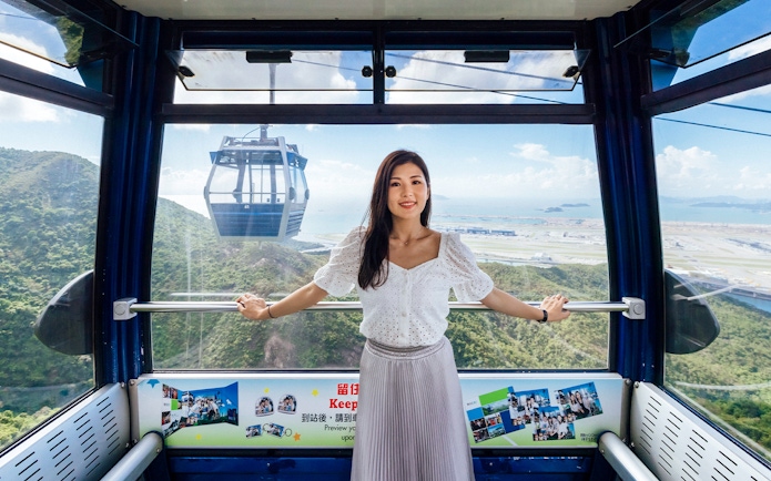 Ngong Ping Cable Car interior with view of Lantau Island, Hong Kong.