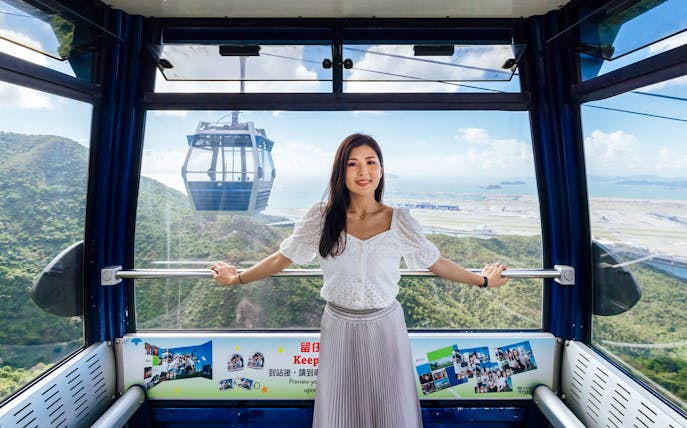 Ngong Ping Cable Car interior with view of Lantau Island, Hong Kong.