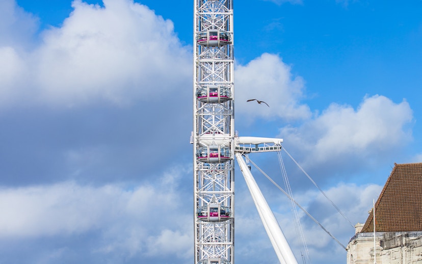 London Eye capsules against a cloudy sky.