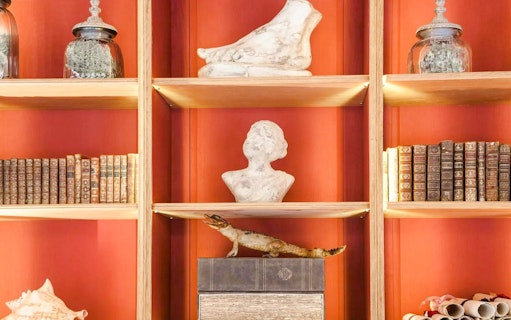 Bust sculpture and antique books on display at Caumont Centre d’Art.