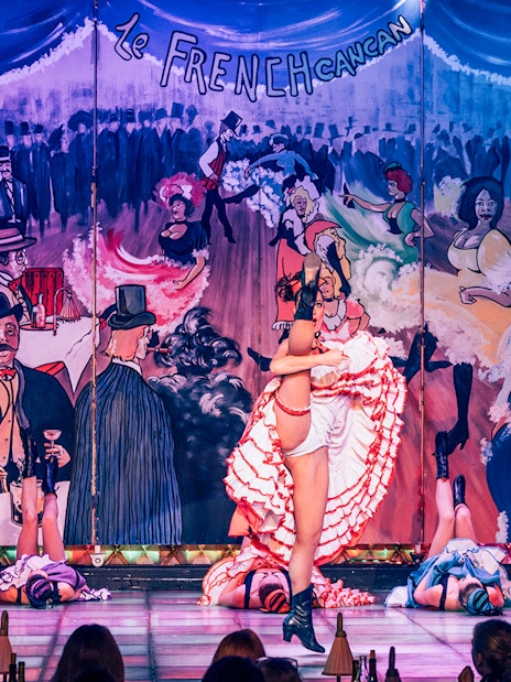 Cabaret La Nouvelle Eve dancers performing French cancan in Paris.