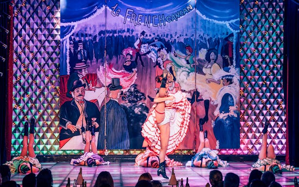 Cabaret La Nouvelle Eve dancers performing French cancan in Paris.