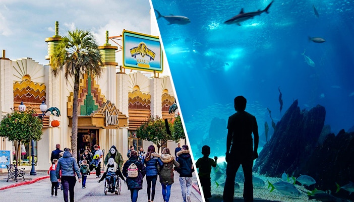 Parque Warner entrance with cartoon character statues, Madrid, combined with Zoo Aquarium Madrid tour.