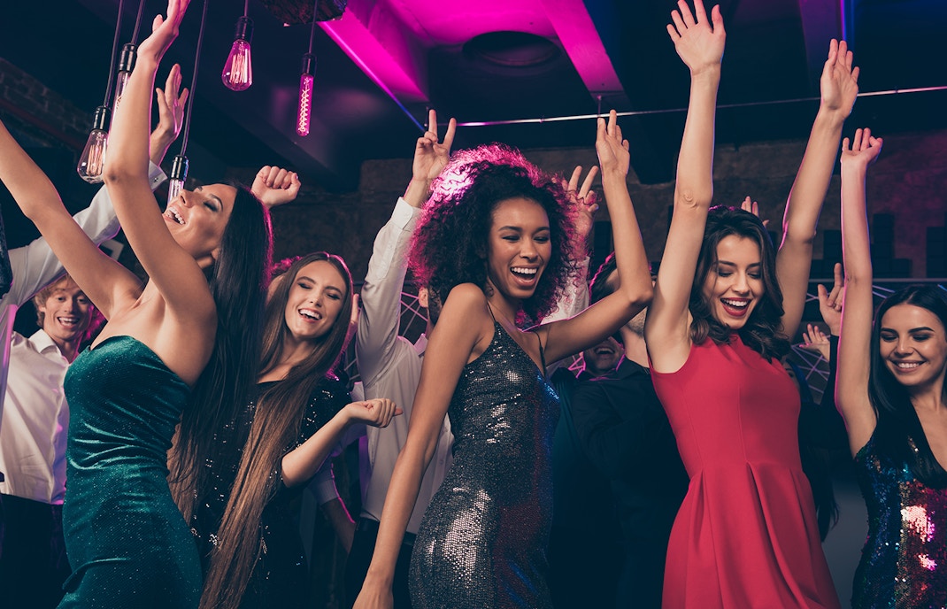 A group pf friends partying late night in a club