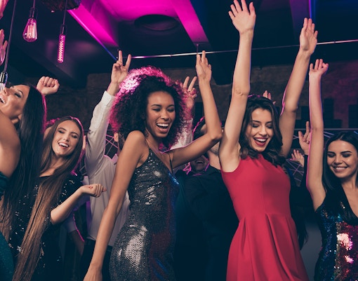 A group pf friends partying late night in a club