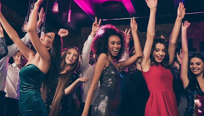 A group pf friends partying late night in a club