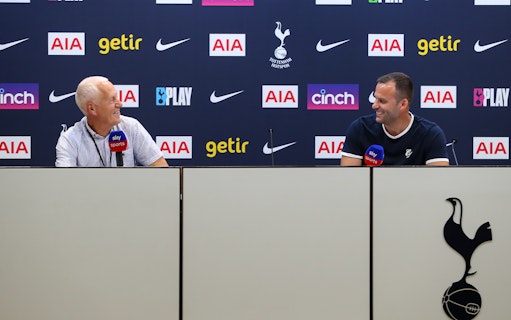 Press conference at Tottenham Hotspur Stadium with two speakers at a table.