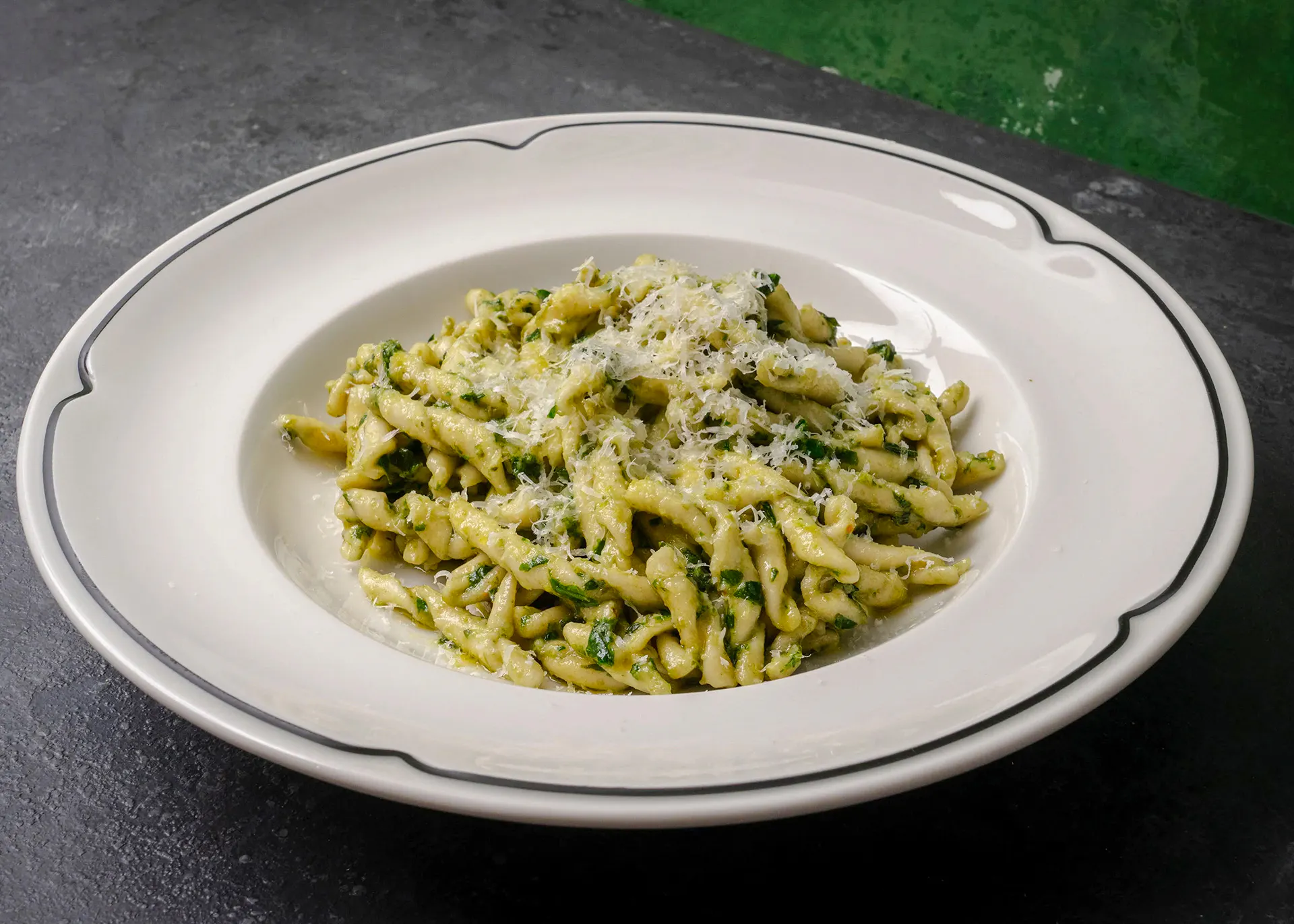 Trofie pasta with pesto sauce and grated cheese, Genoese cooking lesson in Genoa.
