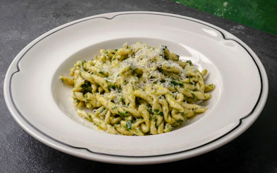 Trofie pasta with pesto sauce and grated cheese, Genoese cooking lesson in Genoa.