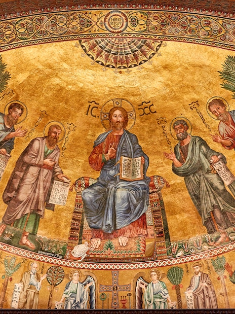 Mosaic of Christ with apostles at St Paul Cathedral, featuring intricate gold background.