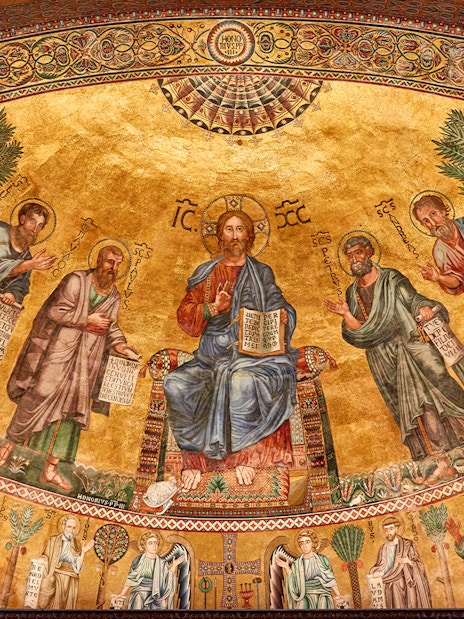 Mosaic of Christ with apostles at St Paul Cathedral, featuring intricate gold background.