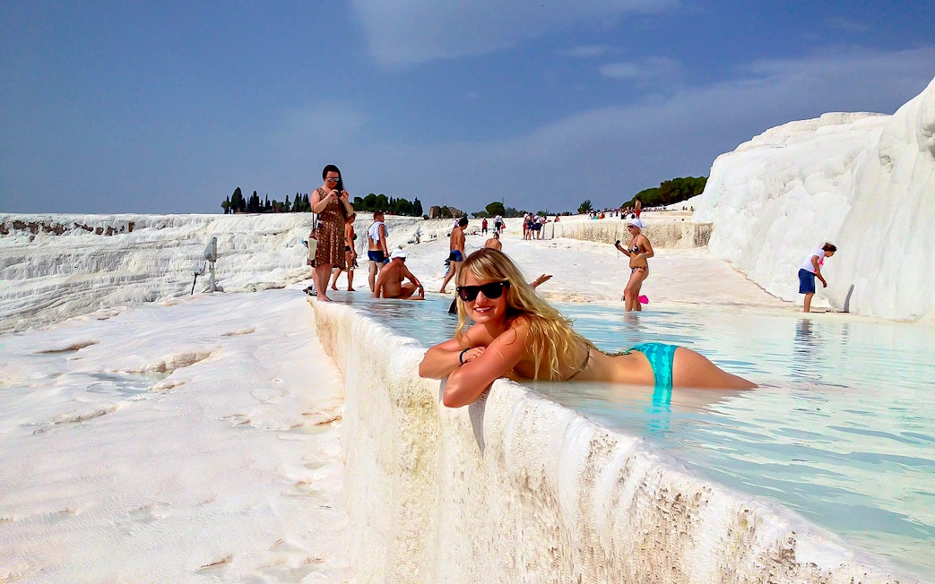 Guests relaxing in the thermal pools of Pamukkale, Turkey.