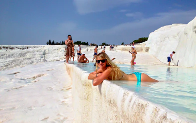 Guests relaxing in the thermal pools of Pamukkale, Turkey.