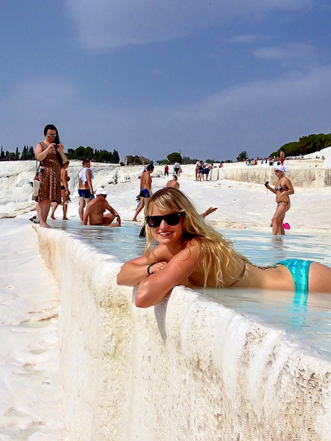 Guests relaxing in the thermal pools of Pamukkale, Turkey.