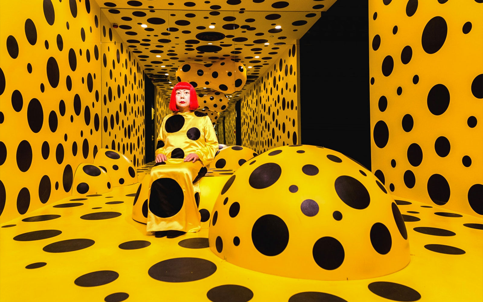 Polka dot room at Madame Tussauds Hong Kong with a figure in a matching outfit.