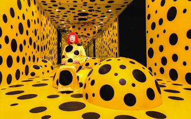 Polka dot room at Madame Tussauds Hong Kong with a figure in a matching outfit.