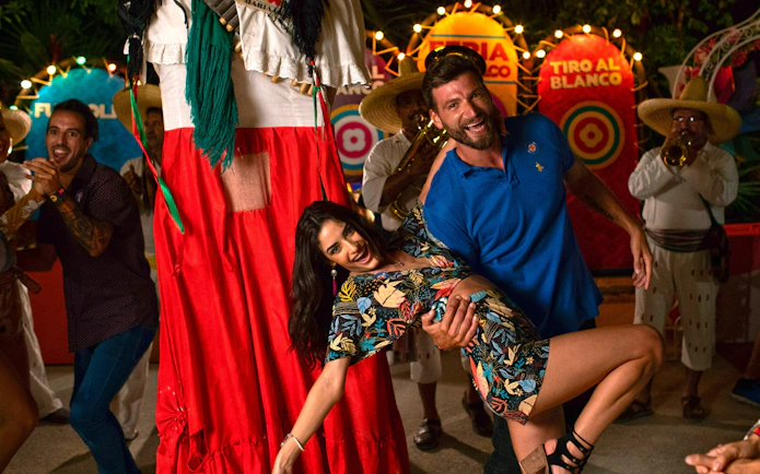 Guests dancing at a festive night event in Xoximilco Park, Mexico.