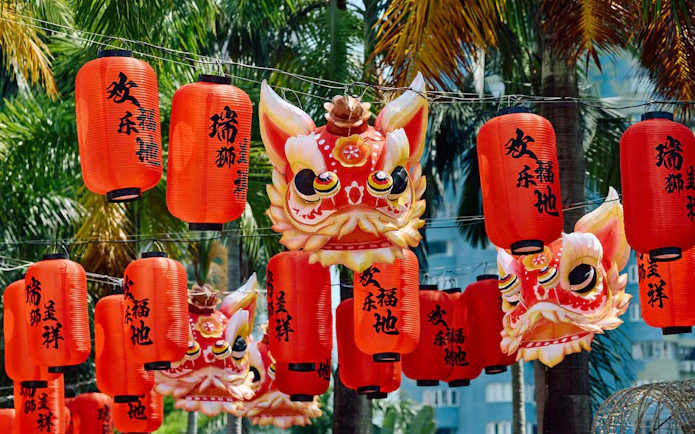 Red lanterns and lion masks at Window of the World theme park, Shenzhen, China.