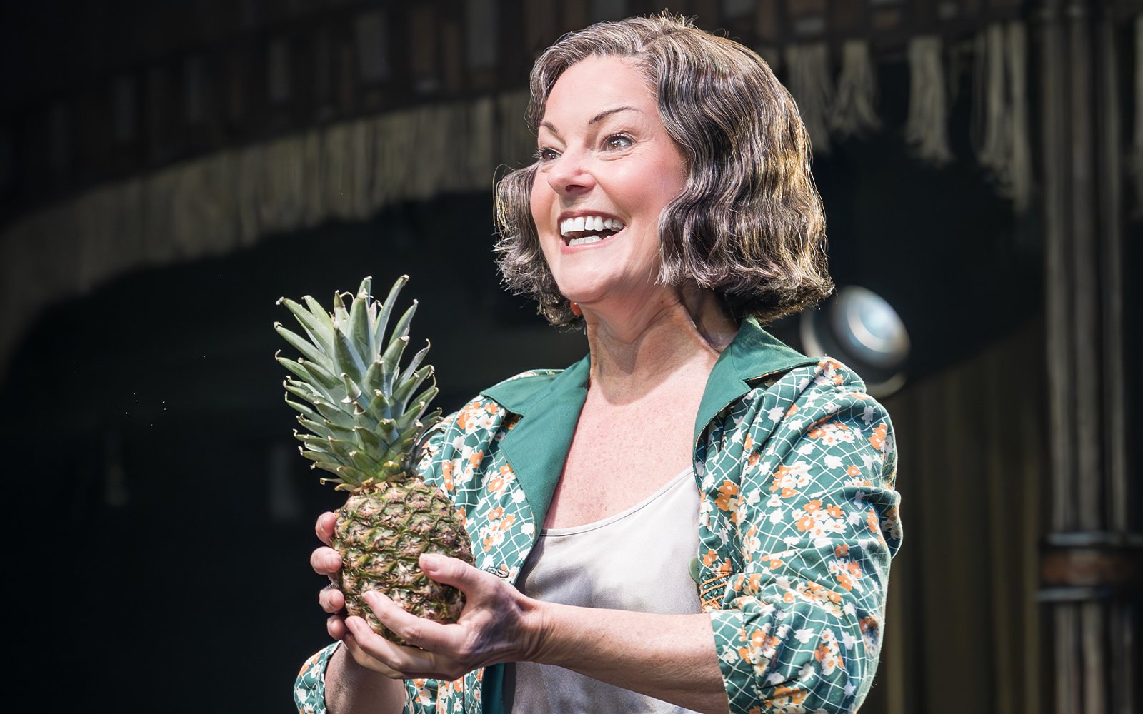Performer holding a pineapple during Cabaret Westend show.
