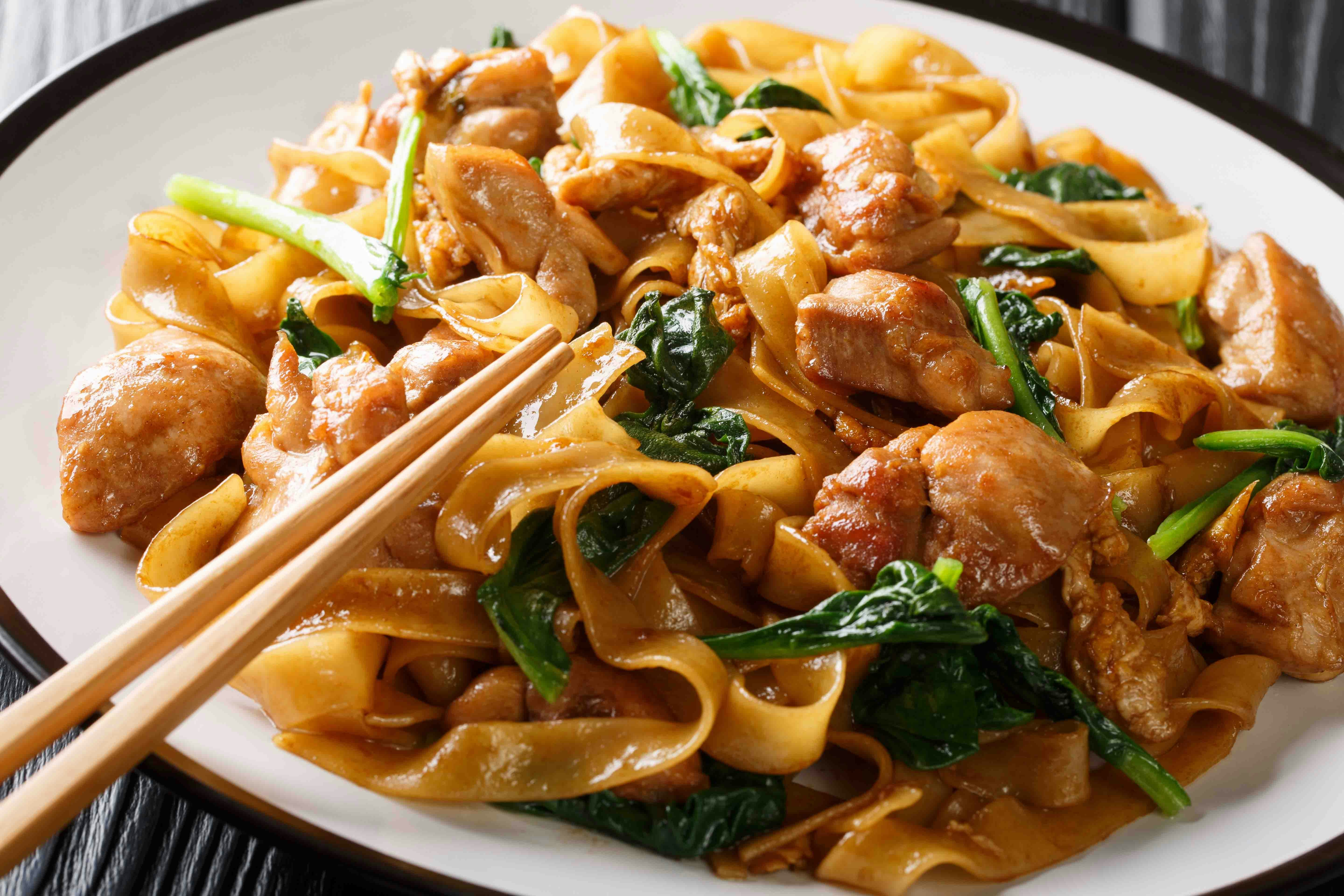 Chinese noodles served in a bowl with chopsticks