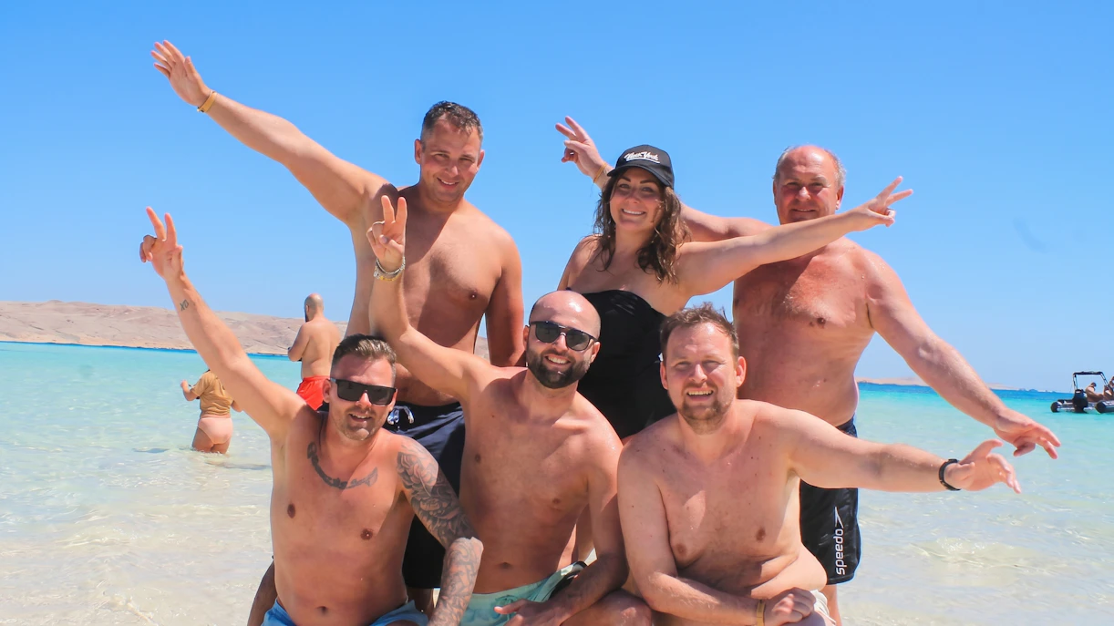 Group enjoying the beach on Orange Bay, Giftun Island, during a private speedboat tour from Hurghada.