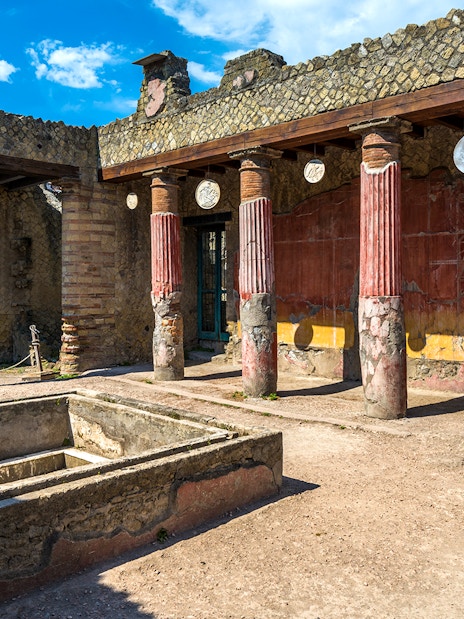 Ancient courtyard with columns at the Ruins of Herculaneum, Italy.