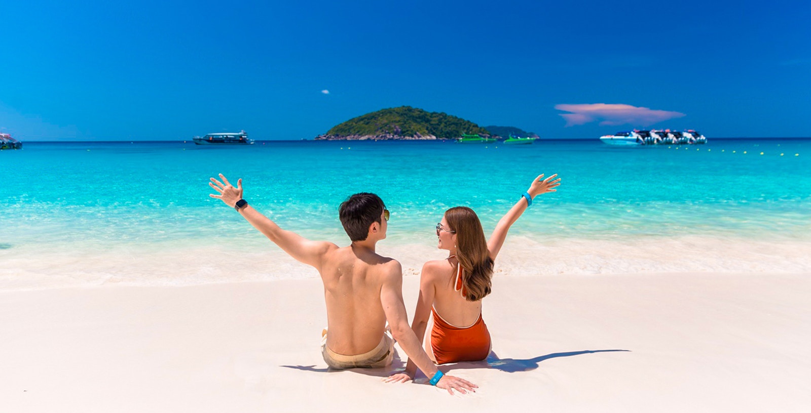 Similan Islands beach with clear blue water and rock formations in Phuket, Thailand.