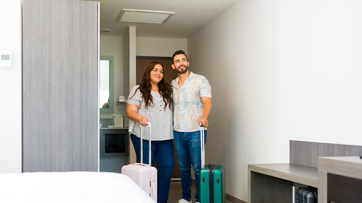 Couple checking in a hotel room