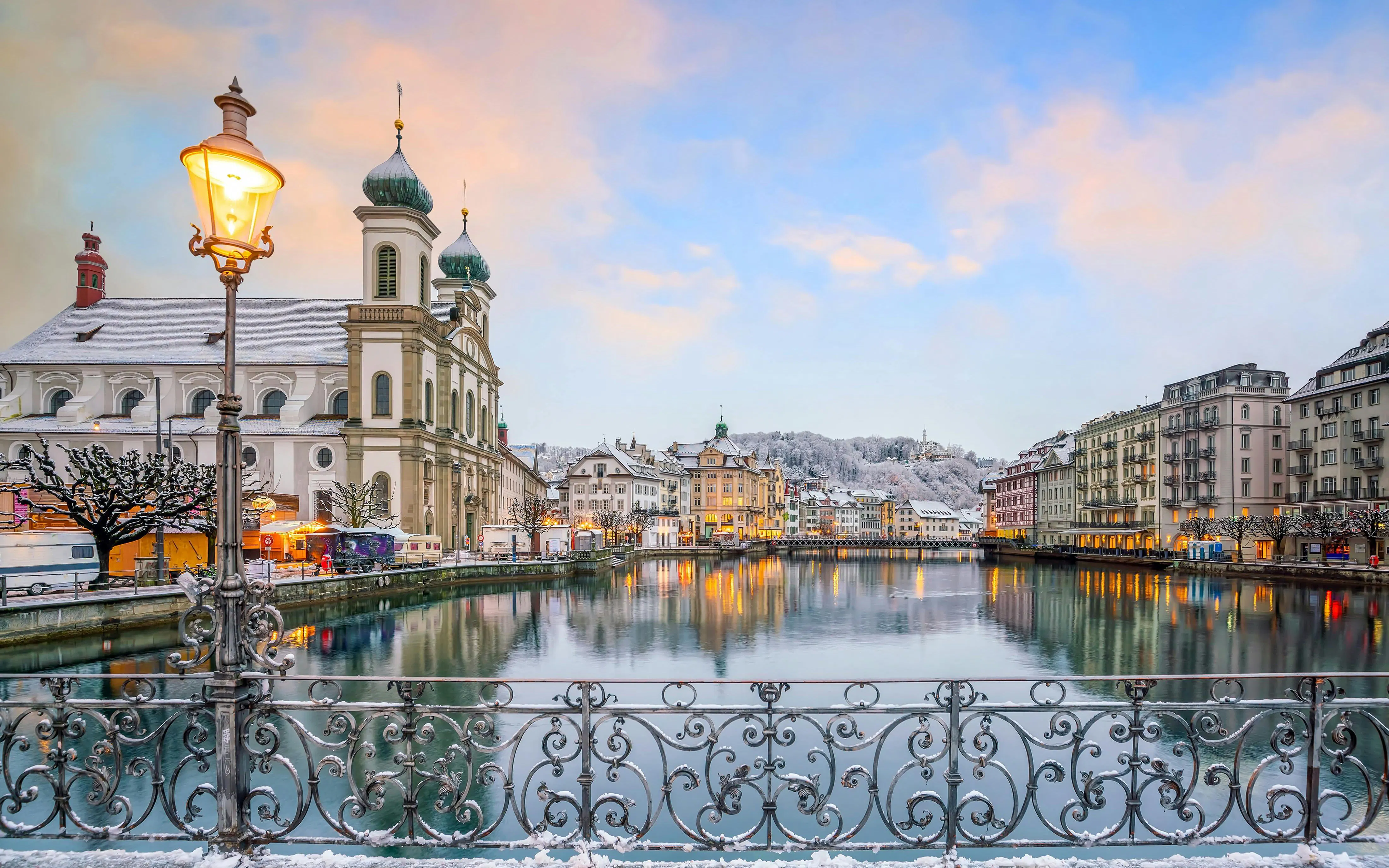 Chapel Bridge and Jesuit Church by Lake Lucerne in historic downtown Lucerne, Switzerland.