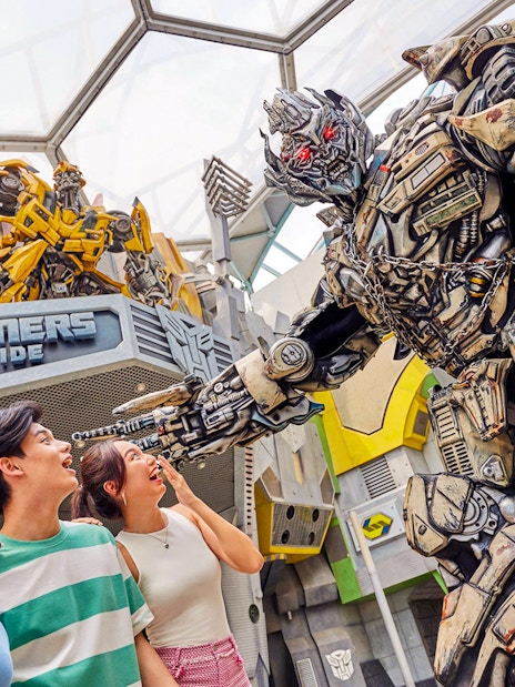 Visitors interacting with Transformers character at Universal Studios Singapore.