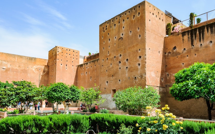 Garden of the Saadian Tombs with historic walls in Marrakech, Morocco.