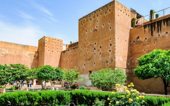 Garden of the Saadian Tombs with historic walls in Marrakech, Morocco.