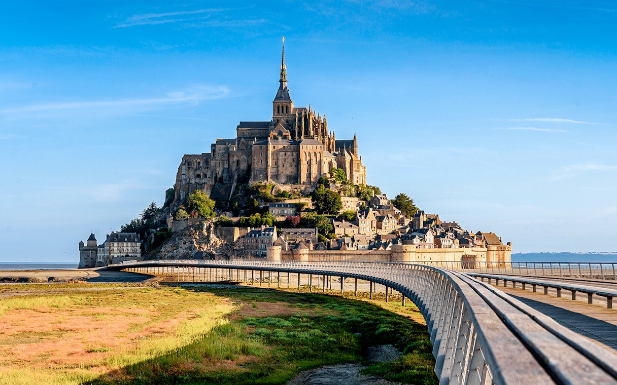 Mont St. Michel Abbey with bridge, viewed from mainland, Normandy, France.