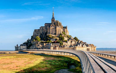 Mont St. Michel Abbey with bridge, viewed from mainland, Normandy, France.