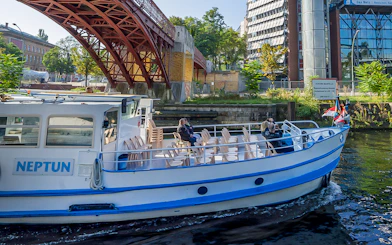 Boat cruising under a bridge on the River Spree during the 3.25-hour tour in Berlin.