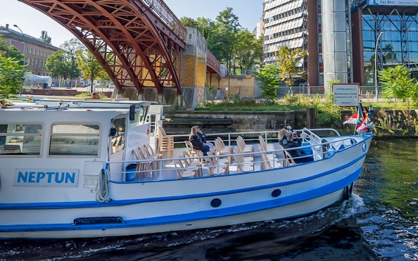 Boat cruising under a bridge on the River Spree during the 3.25-hour tour in Berlin.