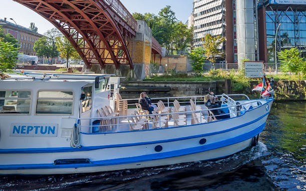 Boat cruising under a bridge on the River Spree during the 3.25-hour tour in Berlin.
