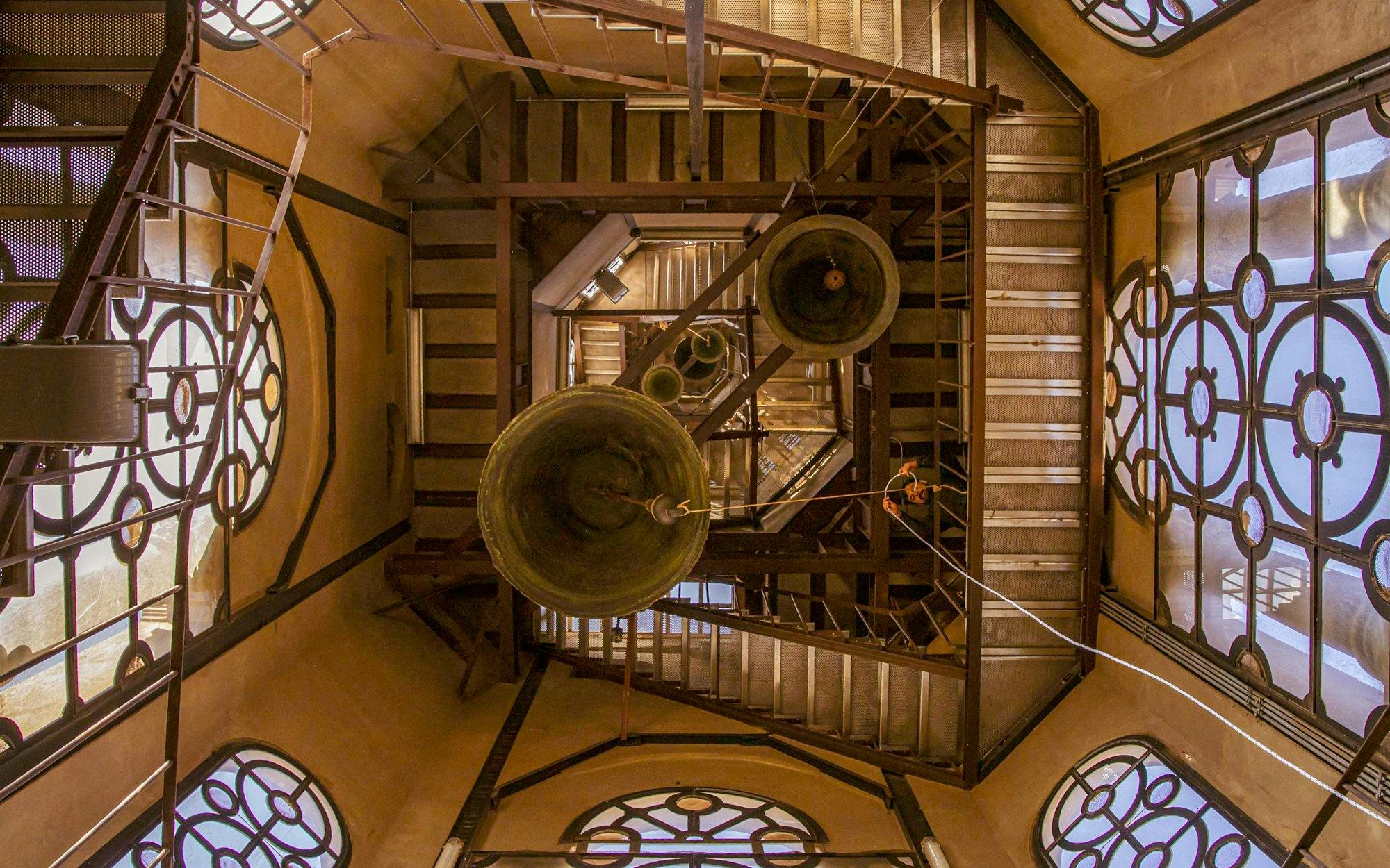 Bells and staircases inside the belfry tower at the Metropolitan Cathedral of Santiago, Chile.
